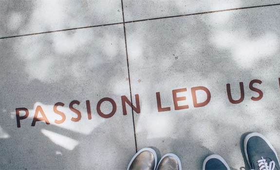 Passion led us here written on a sidewalk